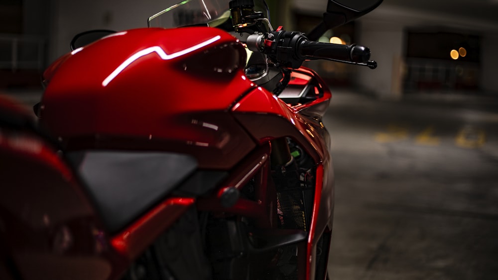 red and black sports bike