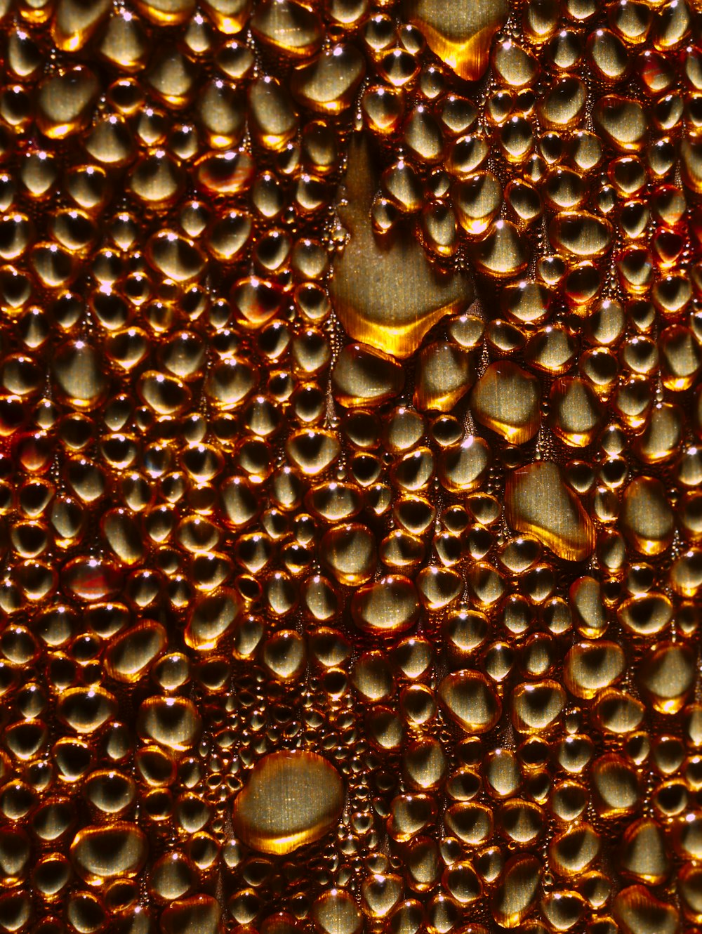 drops of water on brown surface