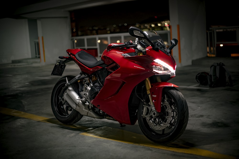 red and black sports bike