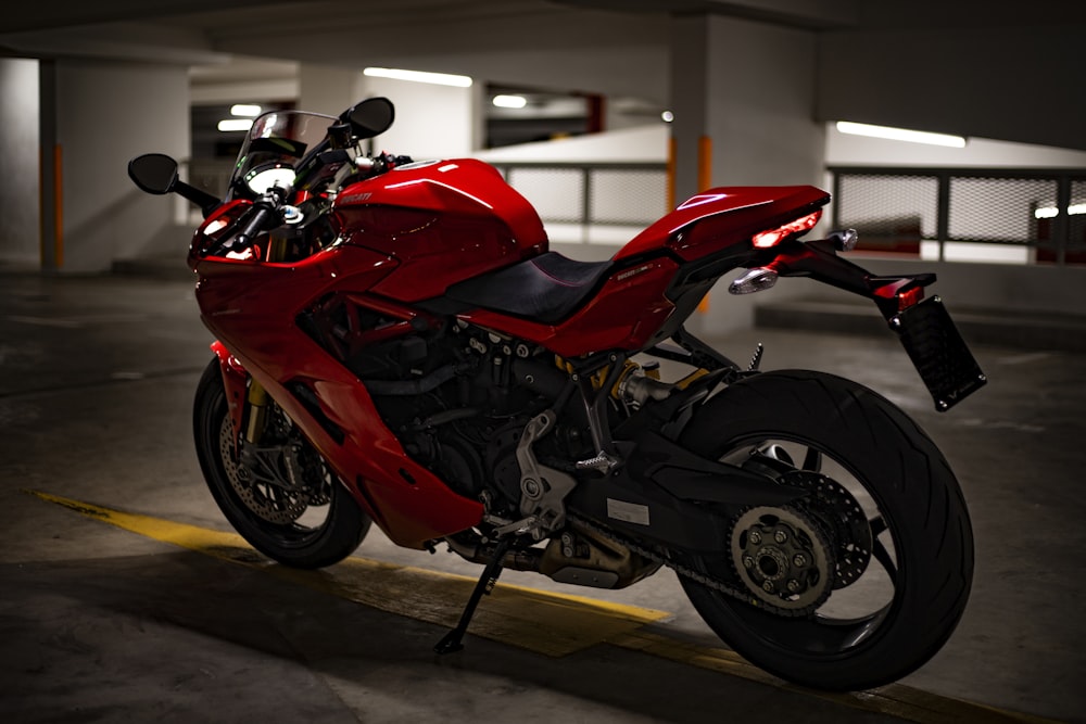 red and black sports bike