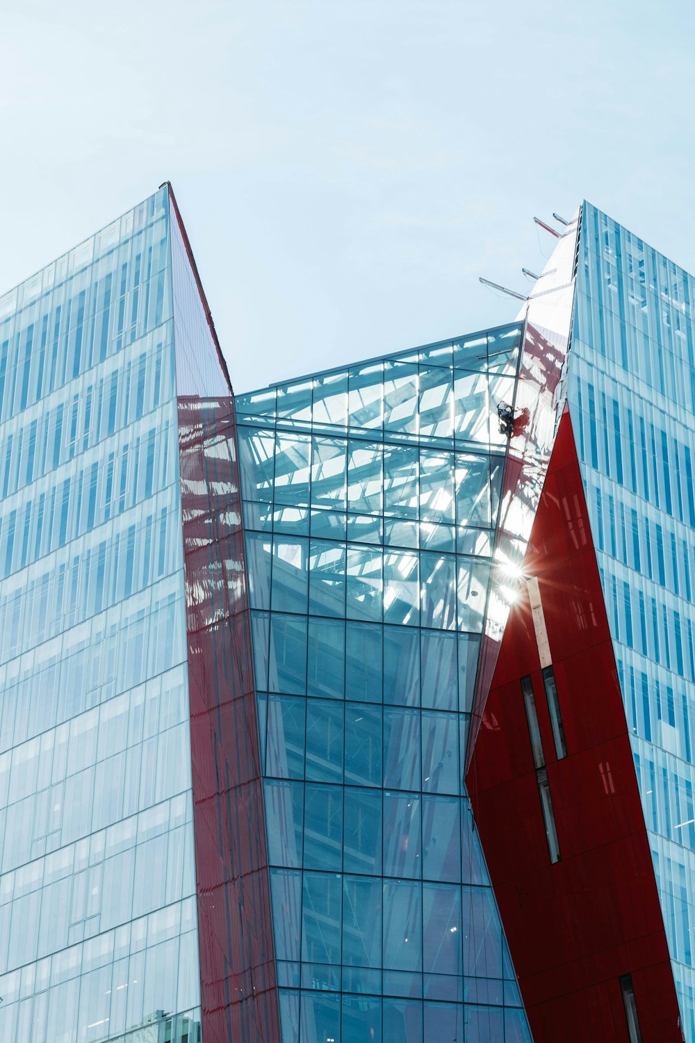 low-angle photography of blue high-rise building