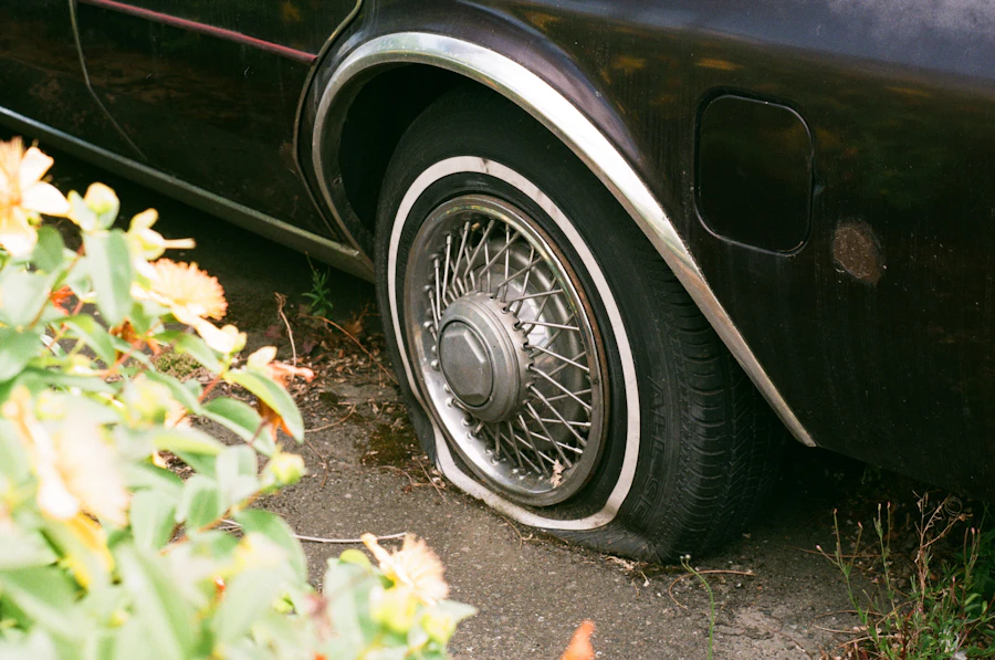 A flat car tyre at the roadside