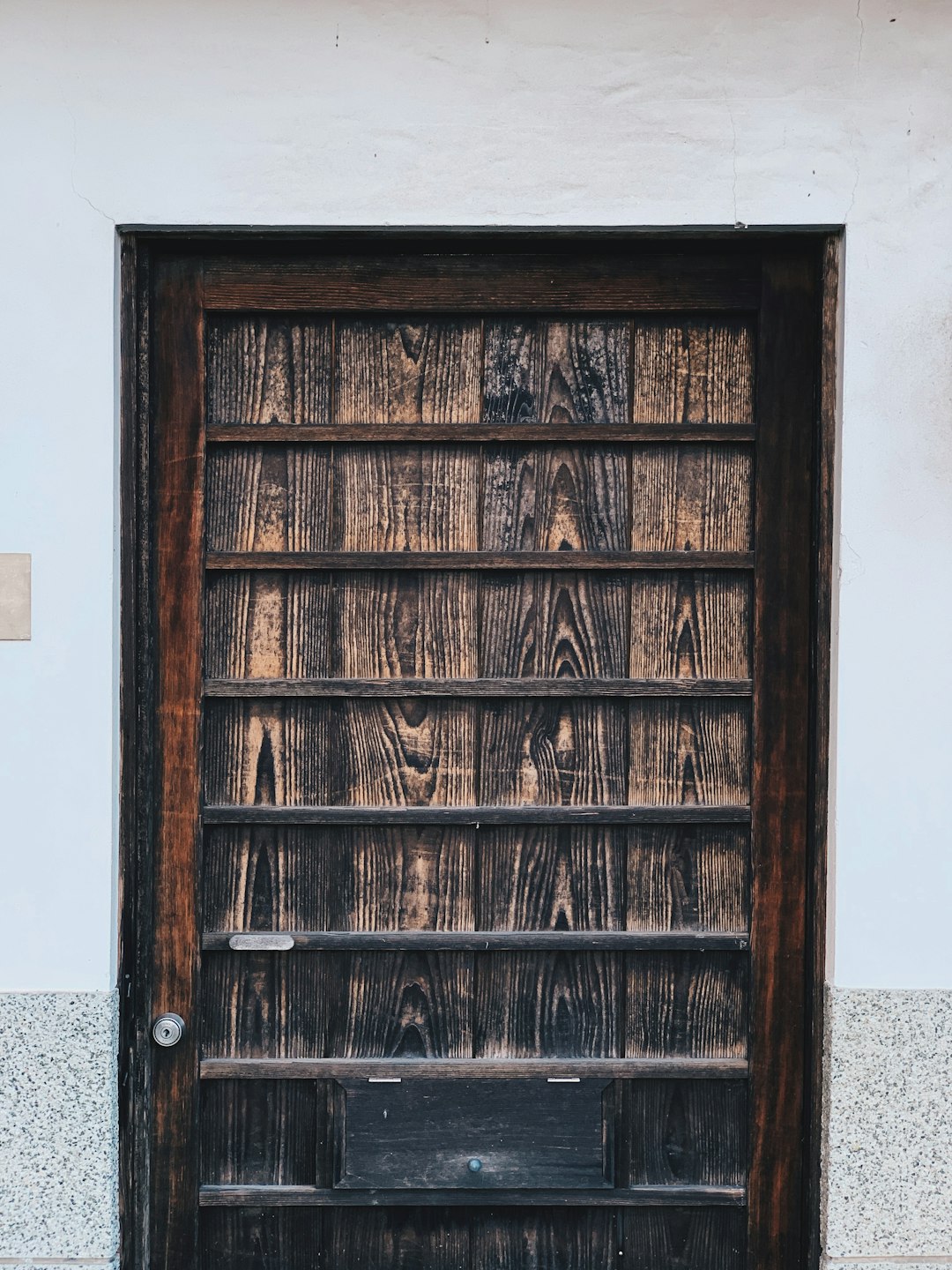 closed brown wooden door