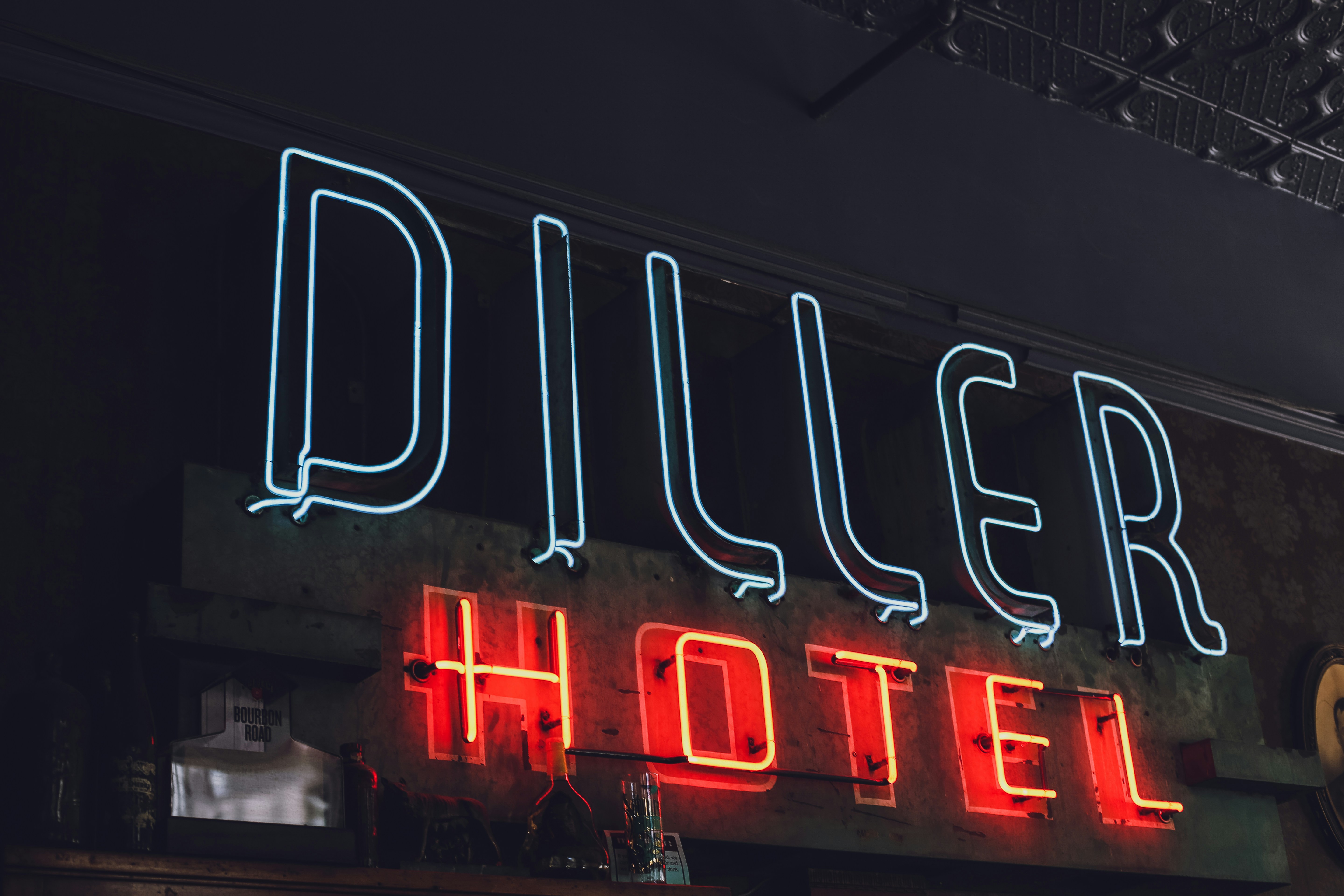 white and red Diller Hotel neon signage