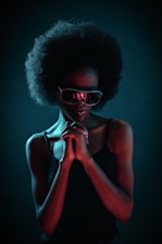 woman wearing black sunglasses and black camisole