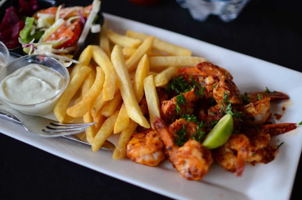 food photography of cooked shrimp and French fries