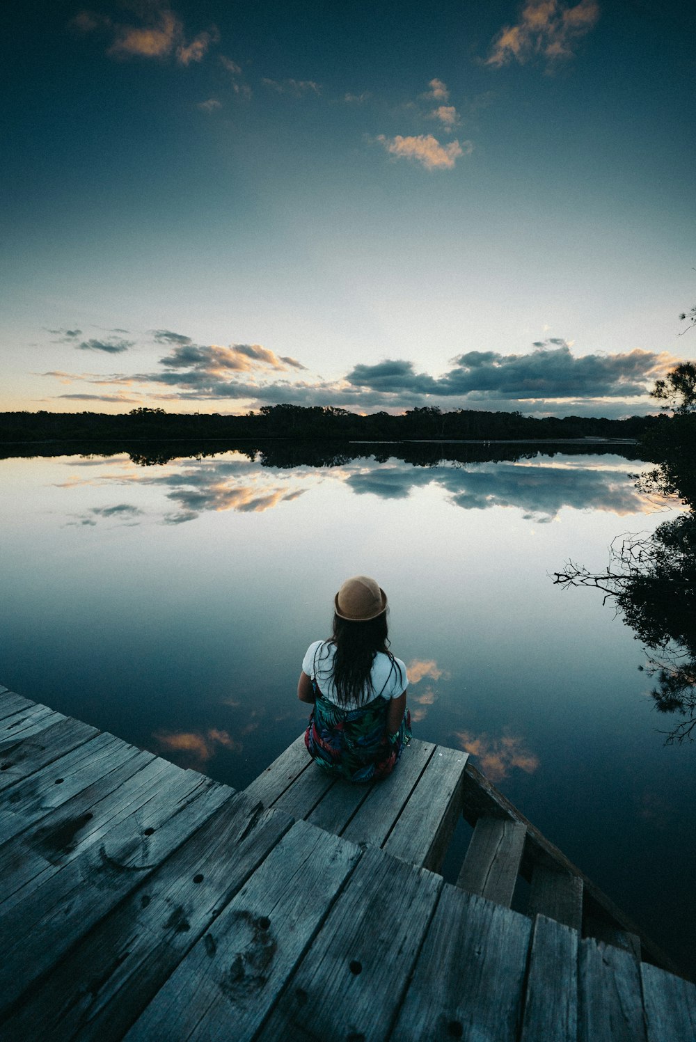 woman sitting on dock