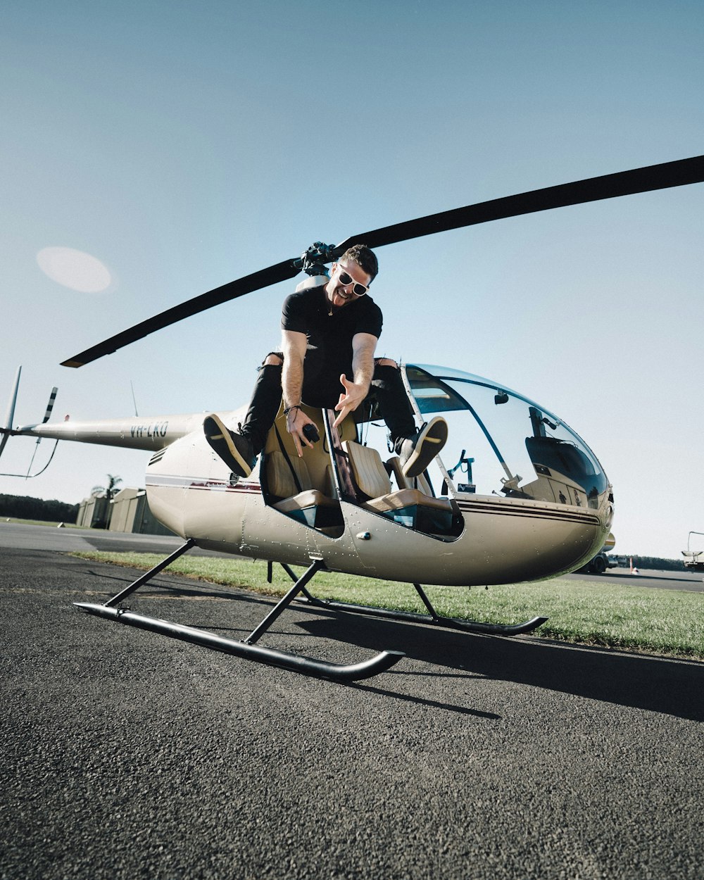 man beside helicopter