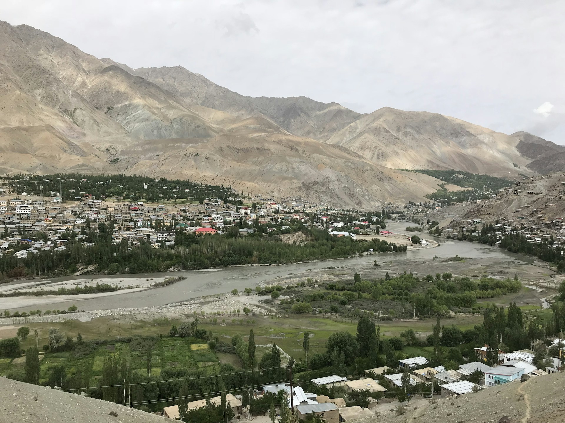 city buildings near mountain