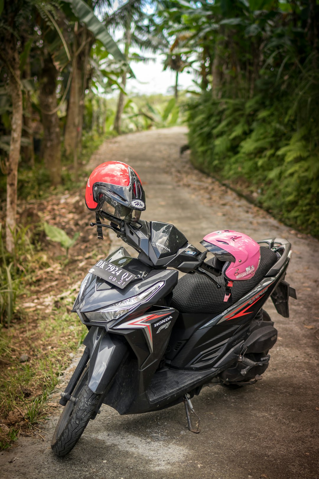 black motor scooter on road