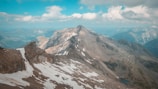 a view of a mountain range from the top of a mountain