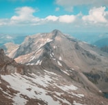 a view of a mountain range from the top of a mountain