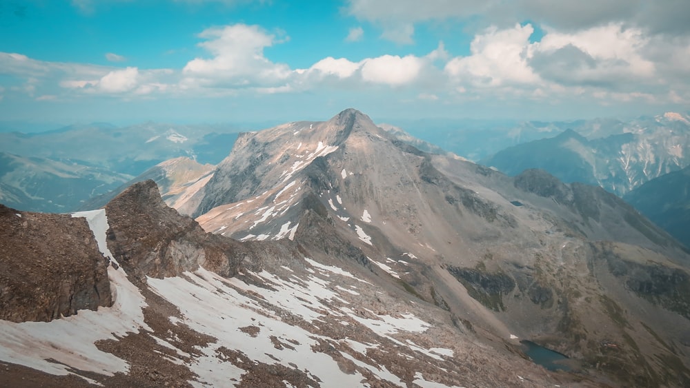 a view of a mountain range from the top of a mountain