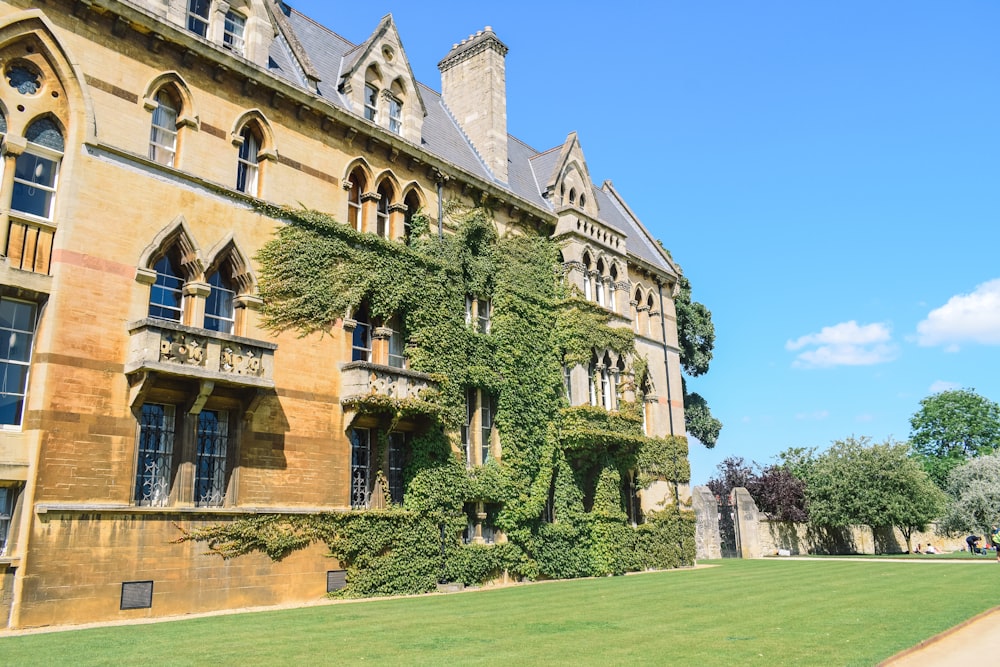 a large building with ivy growing on the side of it