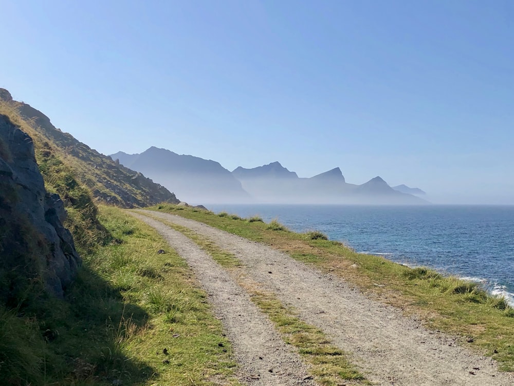 dirt road on mountain island during day