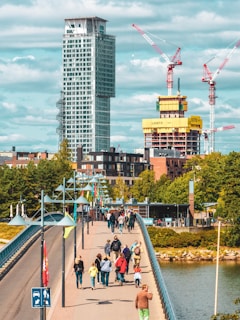 A vibrant cityscape showing various concrete structures including bridges and buildings