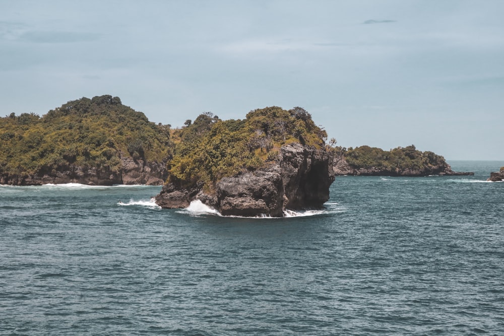 rock formation on the ocean photography