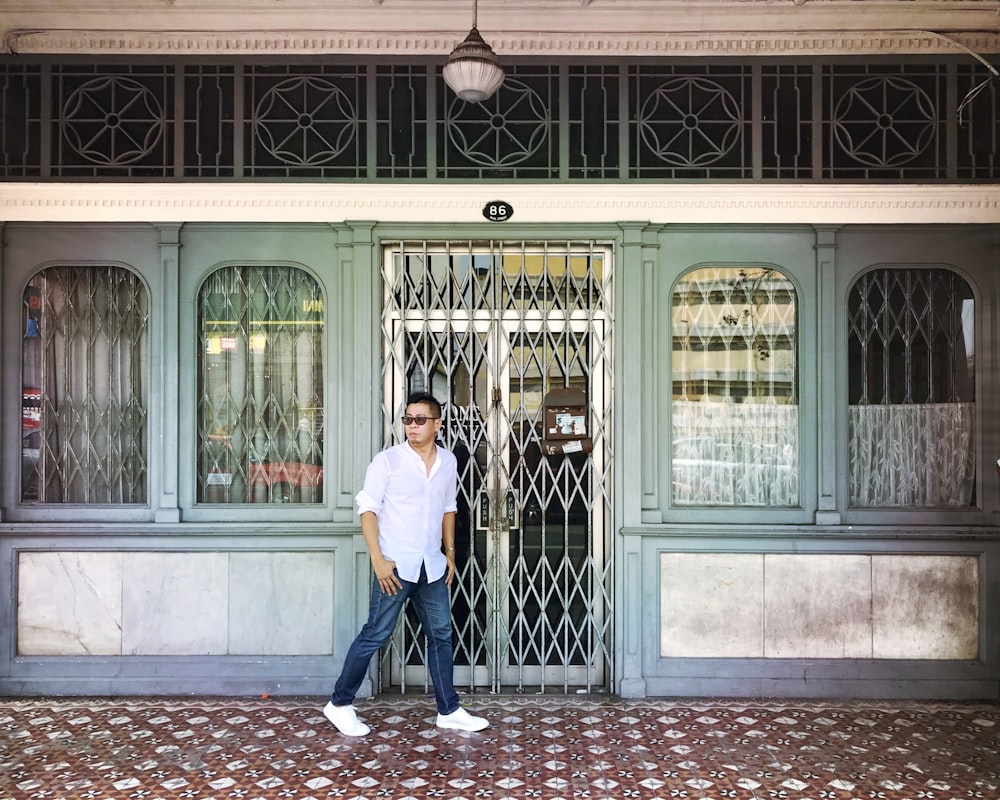 man standing beside slide door