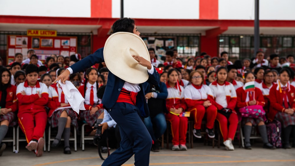 man doing traditional dance at daytime