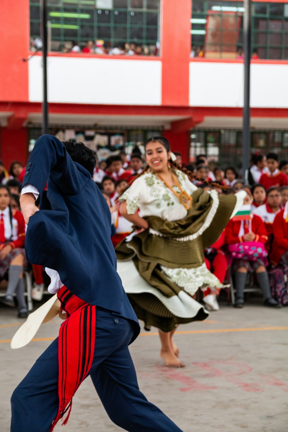 man and woman dancing surrounded with people