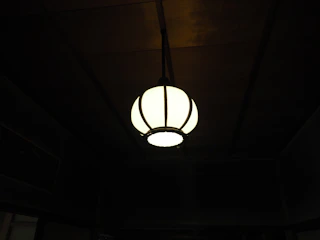 PVC ceiling installation in a cozy family room with warm lighting