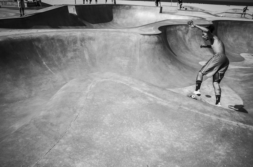 a man riding a skateboard up the side of a ramp