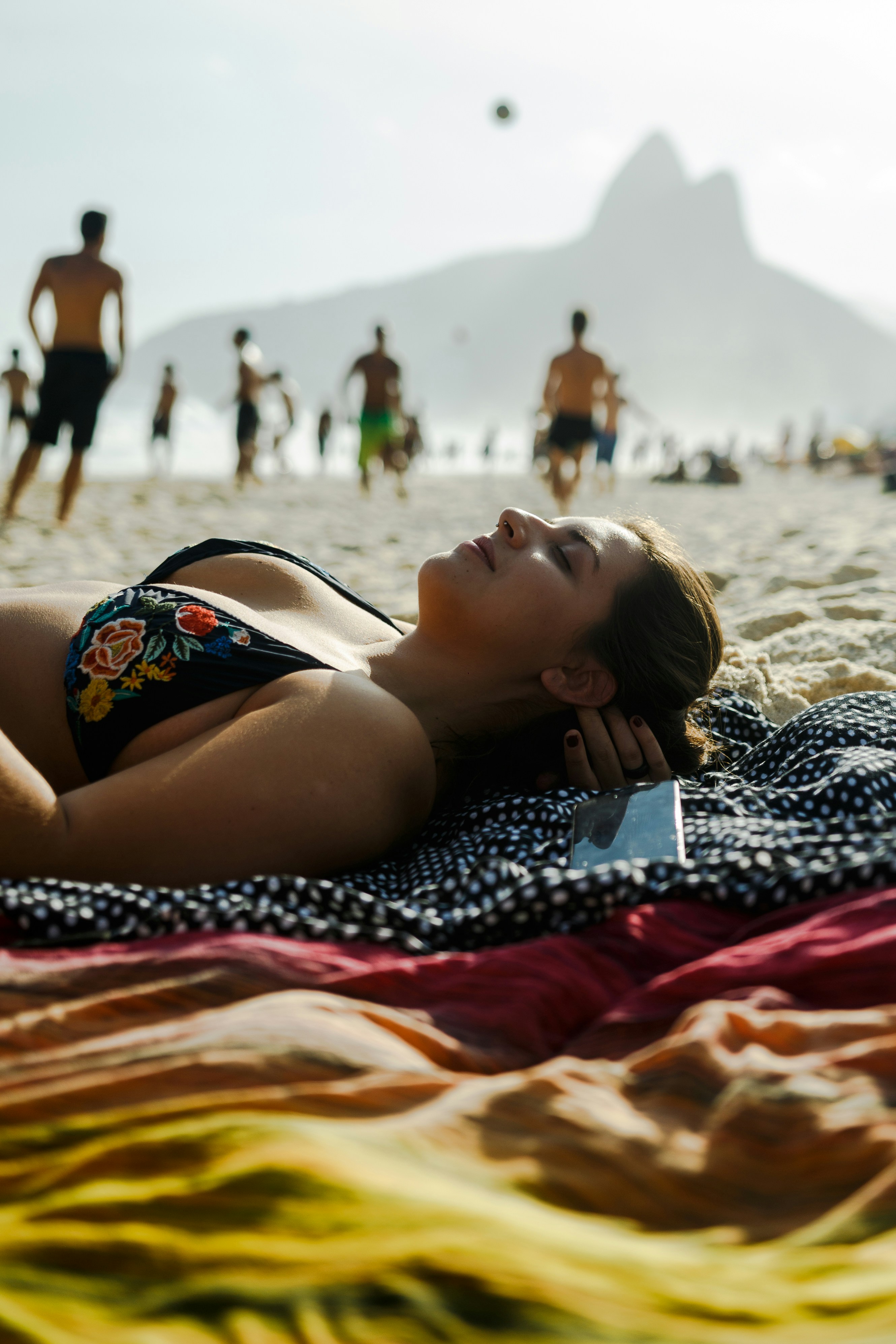 woman wearing black and red floral bikini top during daytime