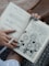 person holds a journal book