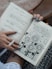 person holds book