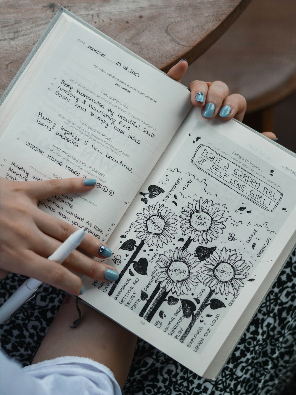 person holds book