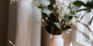 white ceramic cup and saucer inside room