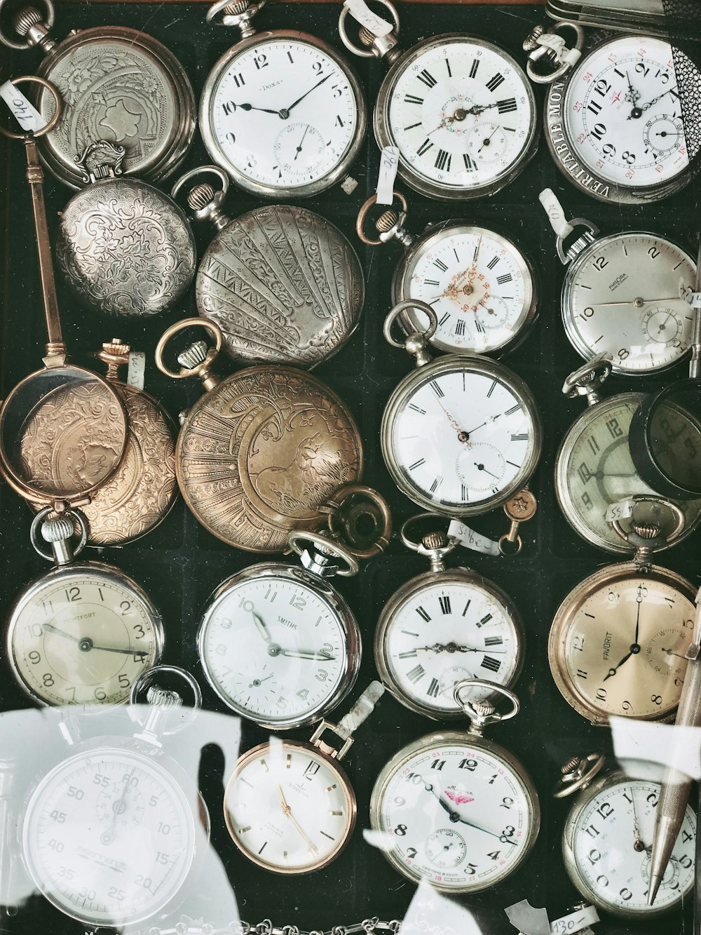 assorted-color pocket watches