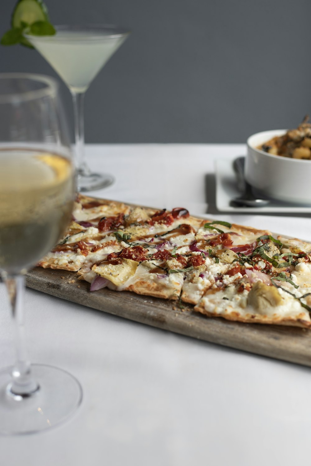 baked pizza near wine glass