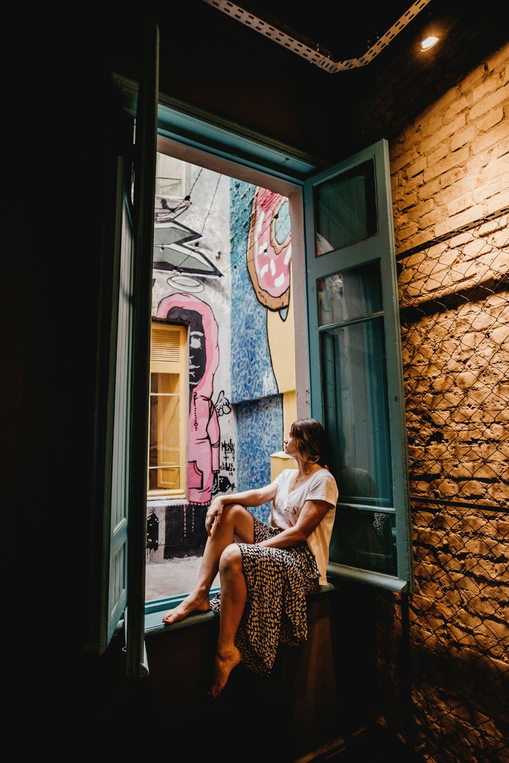 woman sitting by the doorway