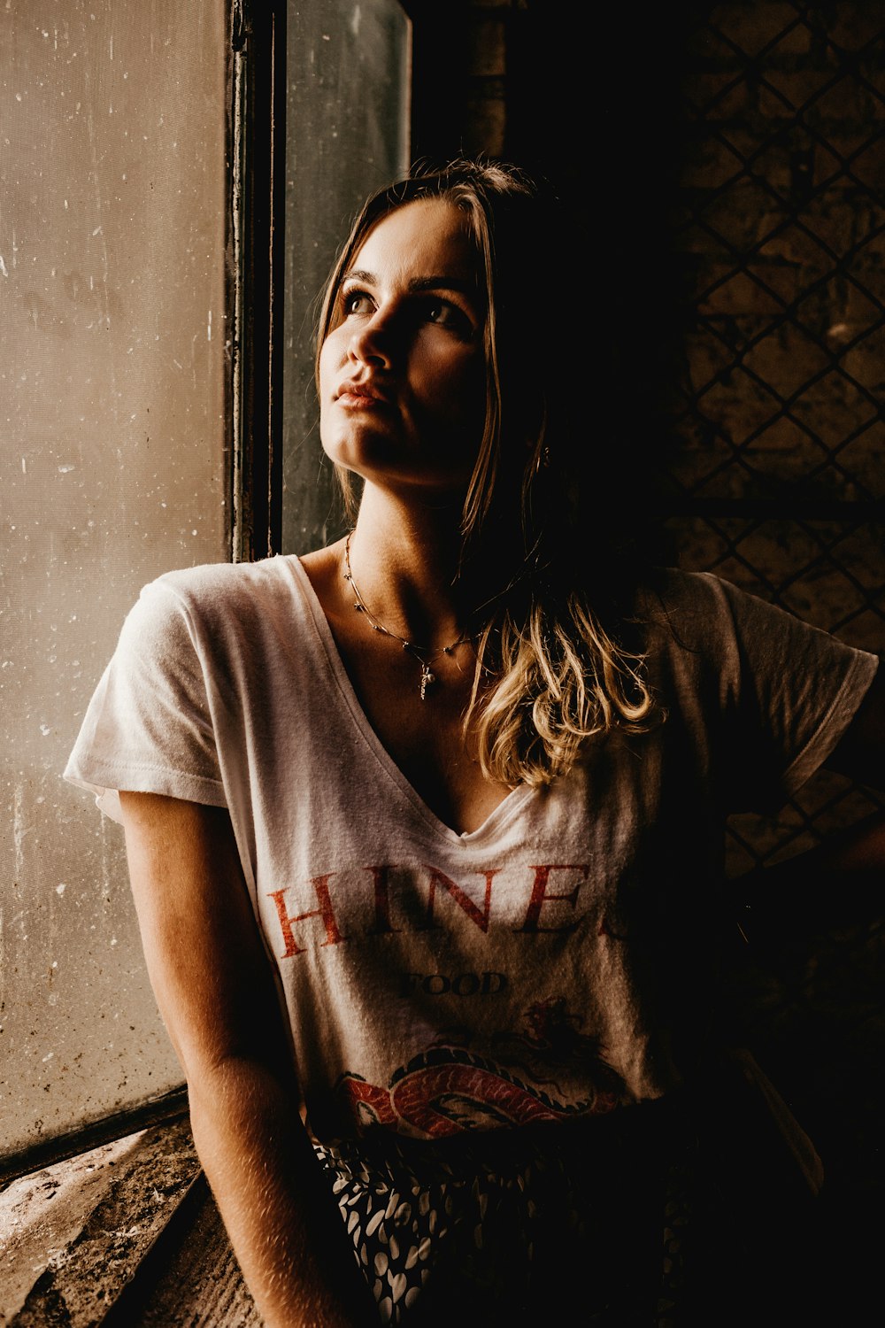 woman wearing white printed shirt