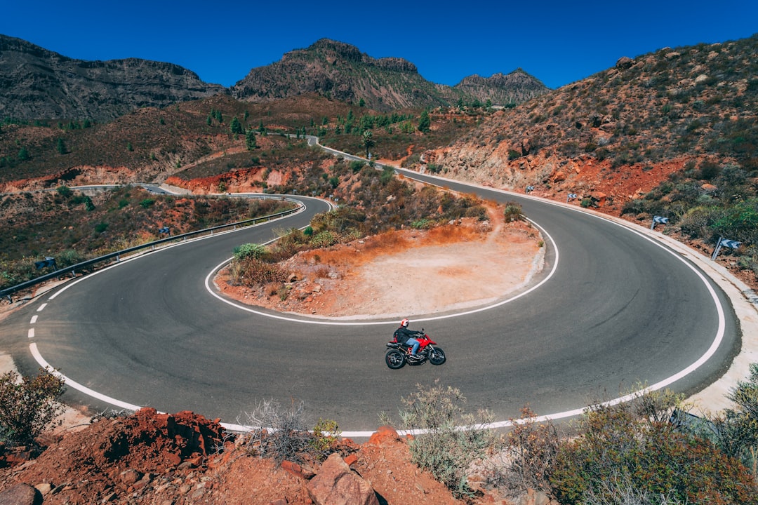 motorcycle on road, Amazing corners on the road from San Bartalome de Tirajana down to Fataga. Motorcycle paradise!