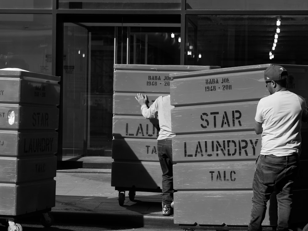 man lifting boxes using trolley