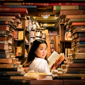Portrait of a smiling female professor in a cozy library setting