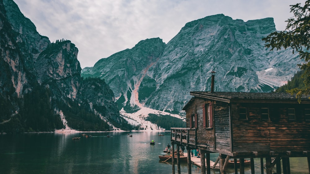 photography of lake beside mountain during daytime