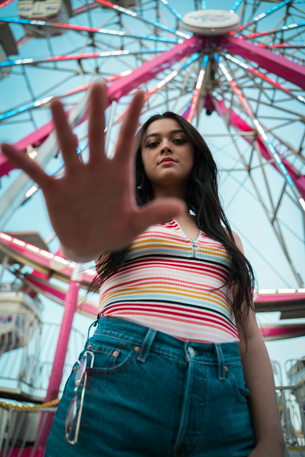 woman standing near ferris wheel