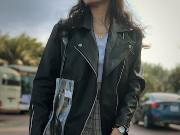 woman wearing black leather zip-up jacket