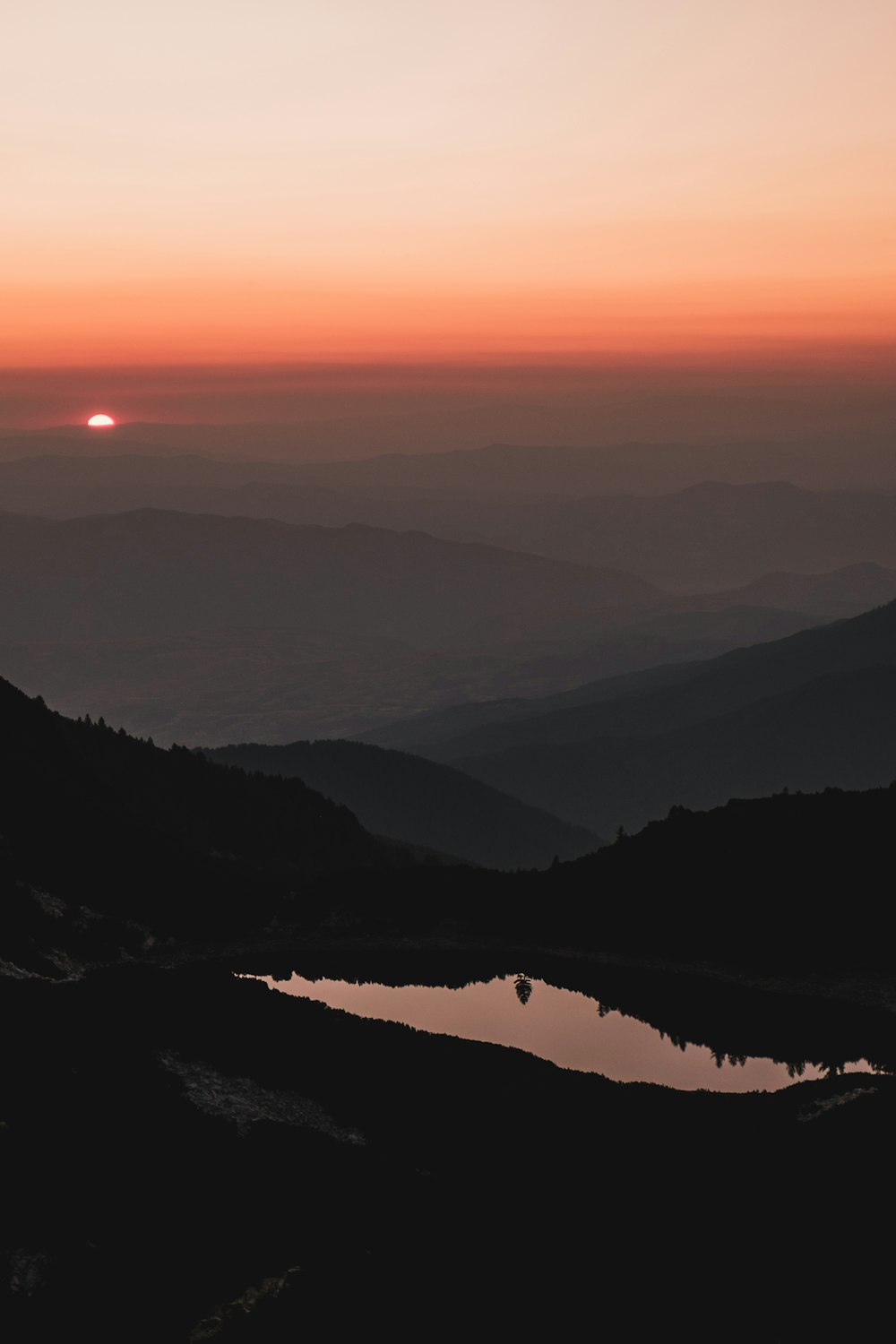 aerial view of lake and mountain