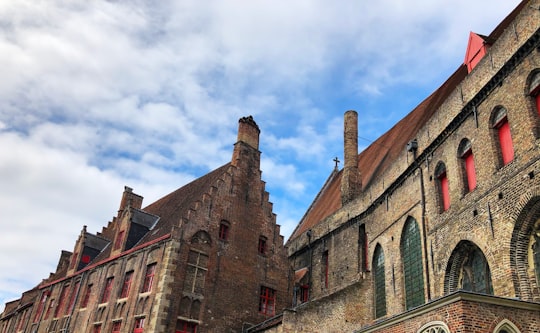 brown concrete buildings under blue sky in St. John's Hospital Belgium