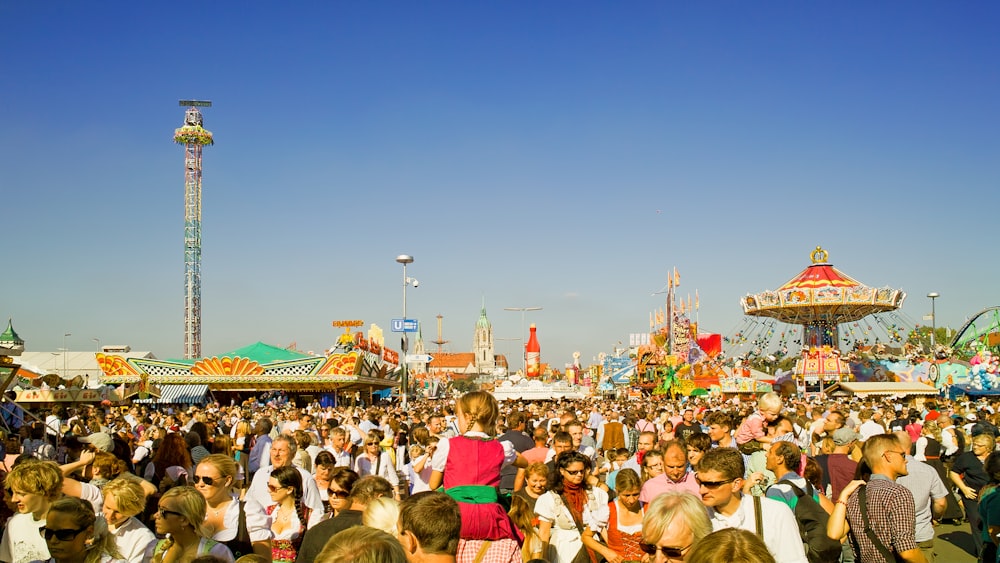 people standing across metal tower