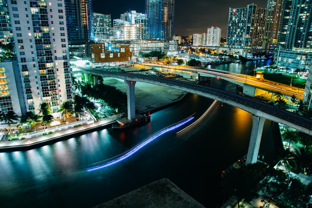 aerial photograph of bridge beside buildings