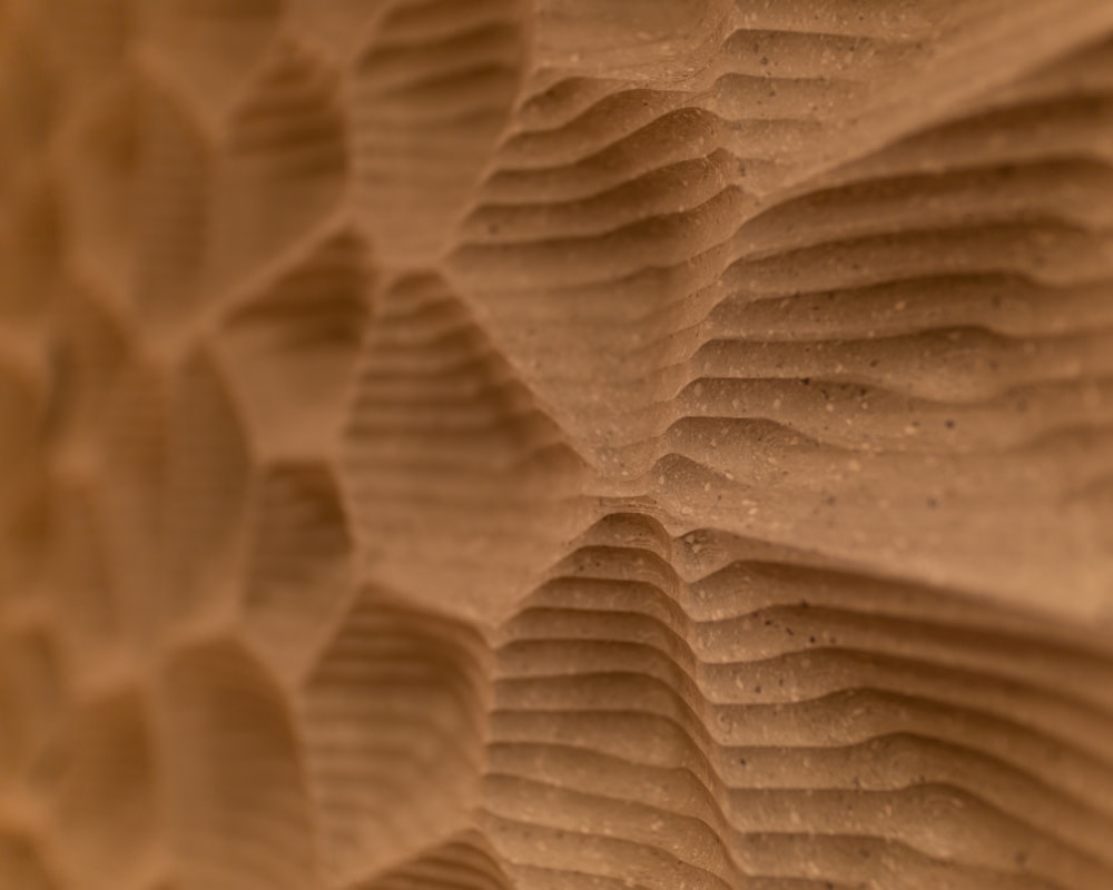 a close up of a wall made of sand