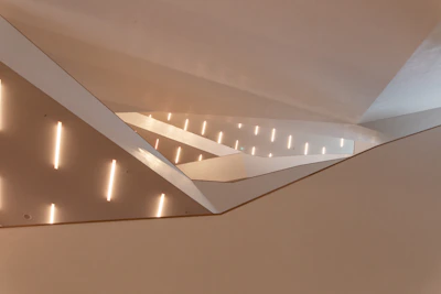 A sleek, modern office space featuring custom joinery and ambient lighting by Eiffen Interior.