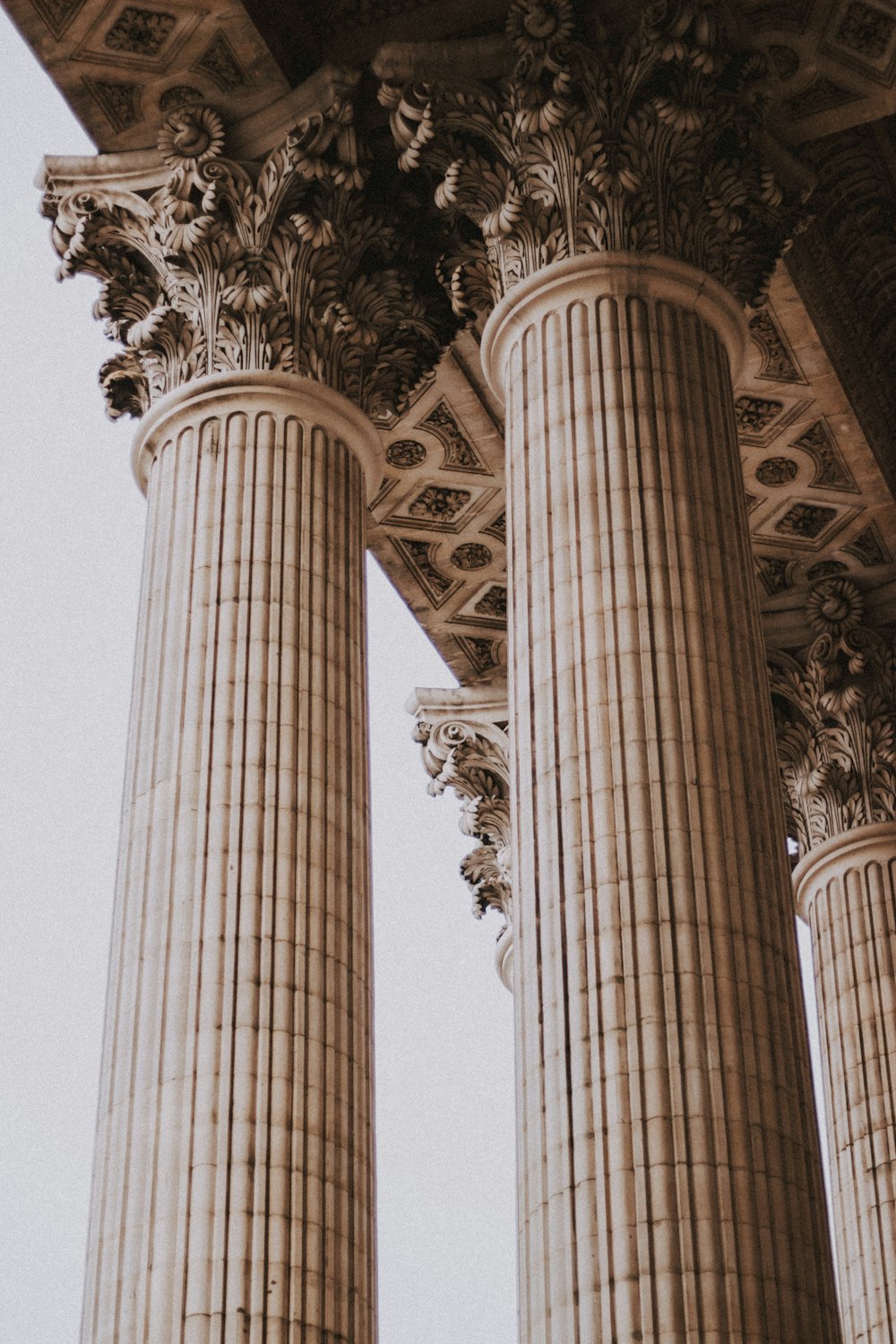 a group of pillars with a clock on each of them