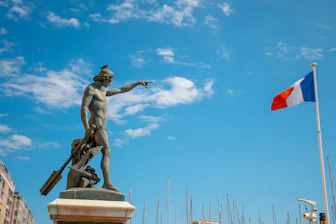 nude man statue near flag