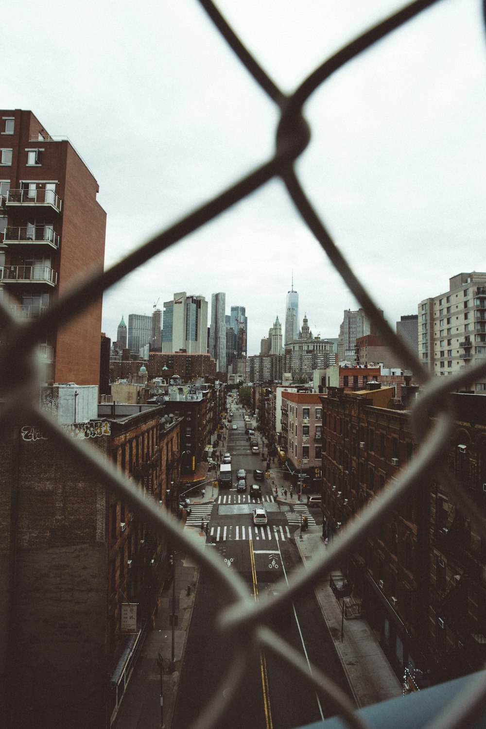 photo of city building with cyclone fence frame